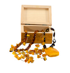 Image showing Amber jewelry and wooden box isolated on white 