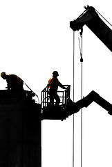 Image showing Workers pouring cement