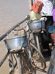 Image showing Woman and her bicycle