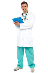 Image showing Portrait of smiling doctor holding clipboard