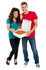 Image showing Young couple about to enjoy pizza together