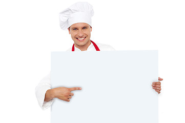 Image showing Chef pointing at the blank white billboard