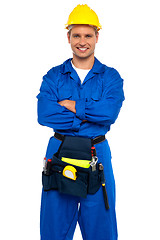 Image showing Young industrial contractor posing with crossed arms