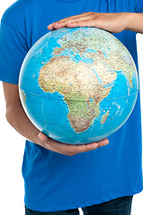 Image showing Guy holding globe, closeup shot