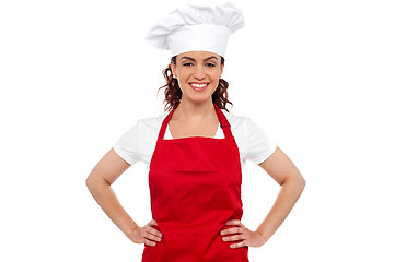 Image showing Cure female chef posing with hands on her waist