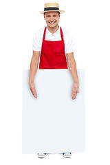 Image showing Male chef presenting you blank advertising board