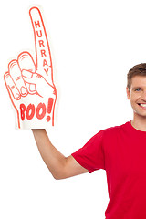 Image showing Cropped image of a casual guy with big foam hand