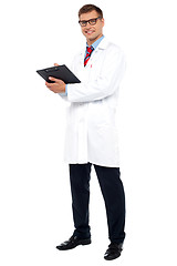 Image showing Full length shot of physician posing with clipboard