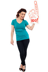 Image showing Woman cheering with large boo hurray foam hand