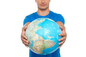 Image showing Closeup shot of man holding globe