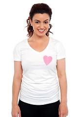Image showing Woman with pink paper heart on her t-shirt