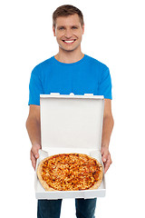 Image showing Smiling man offering pizza to you