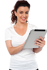 Image showing Pretty woman using tablet device