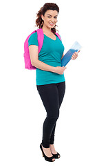 Image showing Student with backpack and spiral notebook