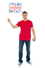 Image showing Causal guy waving United Kingdom flag