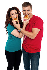 Image showing Adorable love couple enjoying pizza pie together