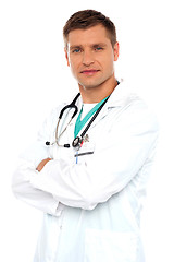 Image showing Handsome young doctor posing with crossed arms