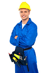 Image showing Young contractor with tool set and arms crossed