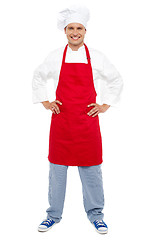 Image showing Relaxed chef standing with hands on his waist