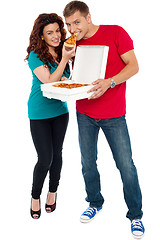 Image showing Couple enjoying pizza together, great bonding