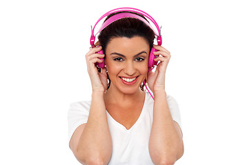 Image showing Young brunette enjoying music