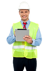 Image showing Male construction engineer using tablet pc