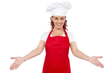 Image showing Smiling woman chef welcoming you