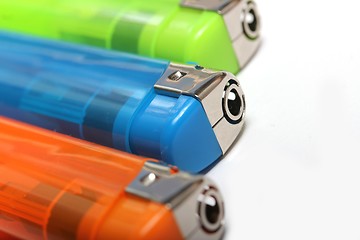 Image showing three colorful lighters