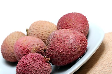 Image showing fresh lychees on a porcelain plate