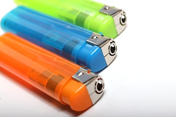 Image showing three colorful lighters