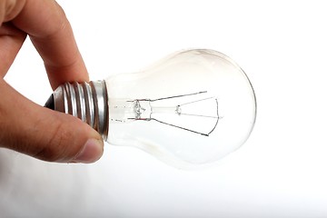 Image showing plain light bulb in human hand