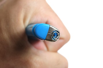 Image showing blue lighter in human hand