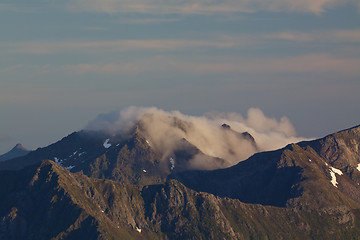 Image showing Mountain peaks in clouds