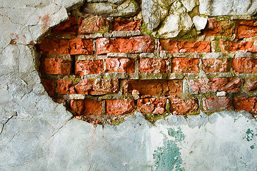 Image showing The destruction of a brick wall