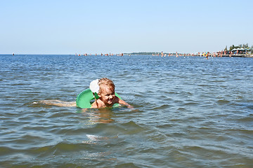 Image showing Little girl swimming