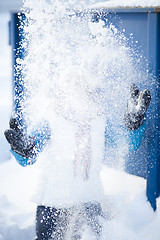 Image showing Woman throwing snow