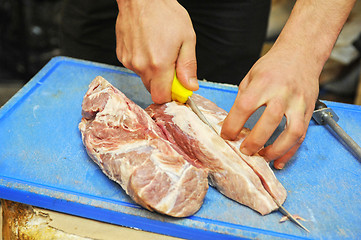 Image showing cutting meat