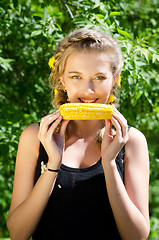 Image showing woman eating corn-cob