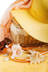 Image showing Beach items a hat, a towel and slippers, it is isolated on wh