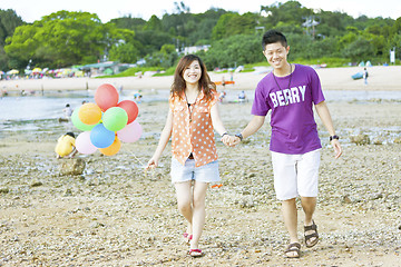 Image showing Happy asian couple at beach
