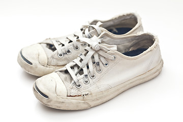 Image showing Old sport shoes on white background