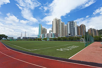 Image showing Running track and stadium in residential area 