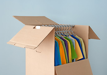 Image showing Multicolored clothes in a wardrobe box for easy moving