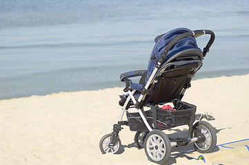 Image showing Kids carriage on a seashore