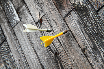 Image showing darts in the wooden background