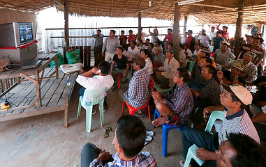 Image showing Villagers watching TV in Cambodia