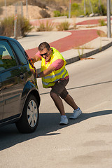 Image showing Pushing uphill