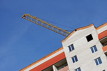 Image showing Crane boom over building