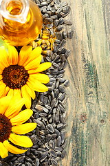 Image showing Seeds, sunflower oil and flowers