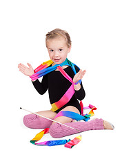 Image showing adorable girl gymnast isolated on a white